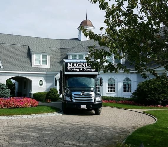 Magnum Moving truck at house